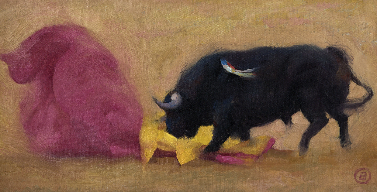 Toro embistiendo capote